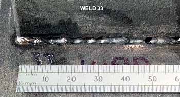 Fig.7. Weld bead appearance for welds made with 1.0mm joint gap, 0.3m/min welding travel; speed Fig.7a) 0mm focus position;
