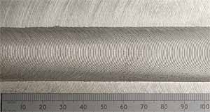 Fig.5. Surface appearance of dual-rotation stir weld made in 16 mm thick 5083-H111 aluminium alloy at a welding speed of 3 mm/sec (180 mm/min), using 584 revs for the probe and 219 revs for the shoulder.