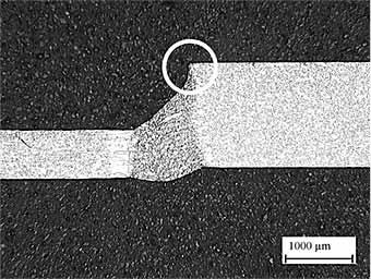 Fig.4. Typical weld made between 0.74mm and 1.5mm thick steel using a single spot, showing unmelted edge