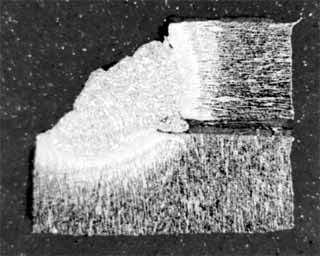 Fig.8. Cross-section of a weave pass Nd:YAG laser weld on cracked BCD hanger welds. Wire feed rate 1.6m/min, laser power 3.9 kW, travel speed 0.2m/min, laser focus 5mm above workpiece surface