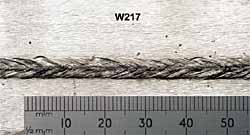 Fig. 4. Weld produced after samples were linished, using 3.0kW laser power at workpiece, Ø0.6mm focus spot, 0mm focus position, 1.25m/min welding speed, 1.4m/min wire feed speed (Ø1.2mm ER2319) 4a) Top weld bead profile