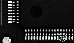 e) Unsoldered lead on Thin Quad Flat Pack (TQFP) IC