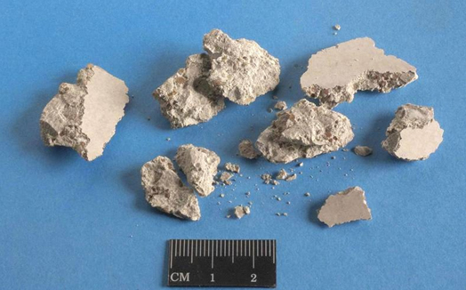 Fig.7. Typical debris from the scabbling process on limestone aggregate concrete