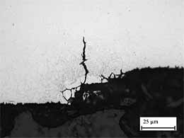 Fig.3b. Detail of the shallow (35µm) intergranular crack 0.5mm from the weld toe of NWA3 (5 passes, with water cooling and 20°C IPT in high grade steel)