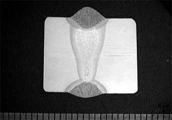 Fig.4b) macrosection showing MAG root and cap beads and central hybrid weld bead