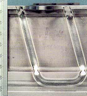 Fig.1. Weld repair, top bead, of a multi-vane stator for the Rolls-Royce RB 199 gas turbine engine using electron beam welding (Photo: Courtesy of Engine Facility, DARA, RAF St Athan).