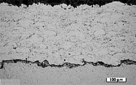 Fig.1c. 316L coating prepared using the DJ system and hydrogen fuel (DJ-316). Dark line at the interface is due to improper sectioning 