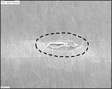 a) SEM micrograph of replica, showing crack TA-1 in Specimen 01 (at N=238,000 cycles, 2c=1.4mm). The area where the crack initiated from is circled;