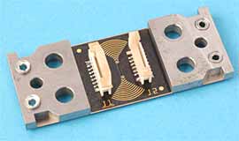 Fig.1. CrackFirst TM sensor with connectors for electronics and reinforcing pads