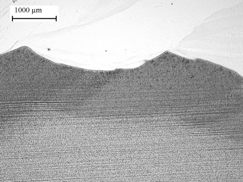 Detail of HAZ, showing effect of tempering. Magnification indicated by micron marker