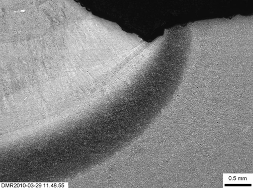 Detail of the weld and HAZ microstructures resulting from test weld W01 (Figure 3) Magnification indicated by micron marker: (a) Microstructure at one end of the weld pad (see Figure 3), showing limited refinement;