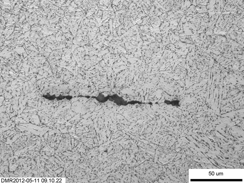 Figure 18. Detail of the broken clustered inclusions evident next to the fusion line in Figure 13