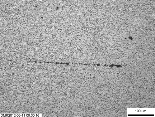 Figure 19. Clusters of parent metal inclusions in W01-50