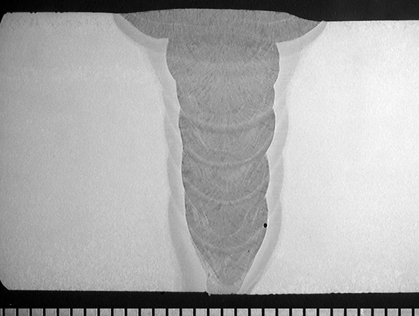 FIGURE 1 Macro-sections of the girth welds in the 16 inch and 20 inch pipes: a) 16 inch