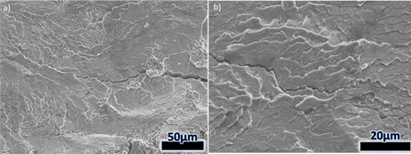 Figure 13 – Images of the 8630-Alloy 625 SENB fracture surface (weld side) in the 10h PWHT condition. A) A large region of cleavage-like fracture. B) Higher magnification image of cracking within the cleavage-like region.