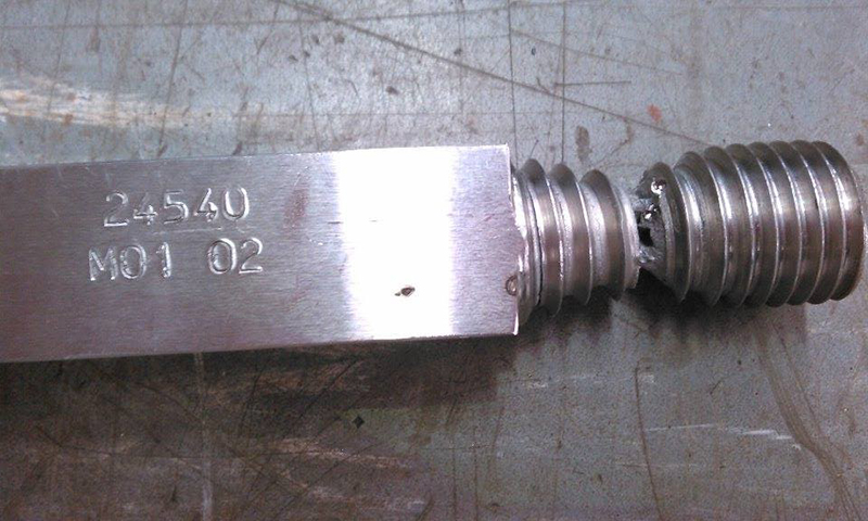 Figure 17 Examples of failure in machined threaded ends in SENT specimens in M01, with (b) a thread fracture from a notch depth of a/W of 0.23