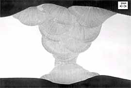 Photomacrograph showing the typical geometry of longitudinal welds in 72inch elbow fittings 