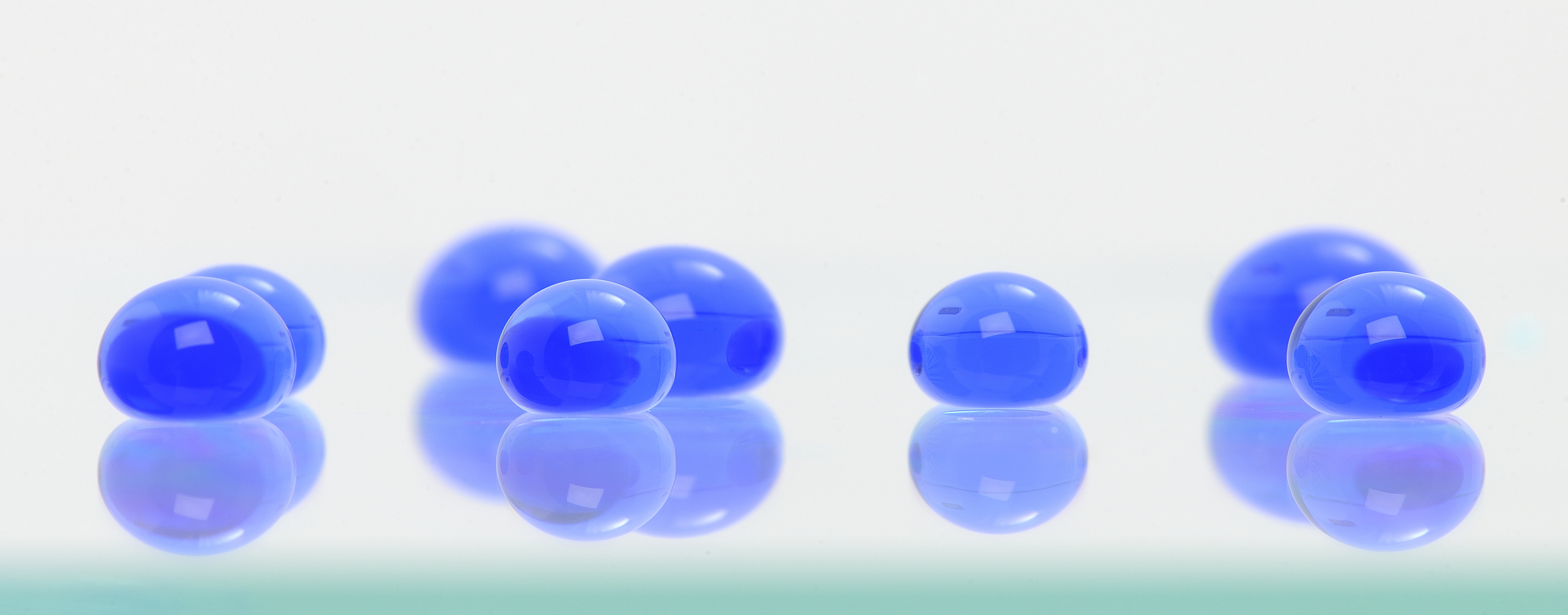 Coloured water droplets on a surface treated with a superhydrophobic coating developed at TWI