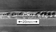 Fig. 2. Surface breaking pores (T fillet weld in primed plate)