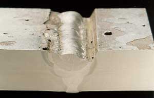 b) Smooth weld bead profile allows the slag to be readily removed between runs