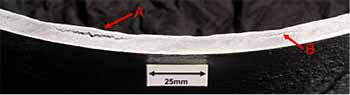 Fig. 1. Magnetic particle inspection of the pipeline sample examined by TWI, showing internal blistering (A) and hydrogen induced cracking (B)