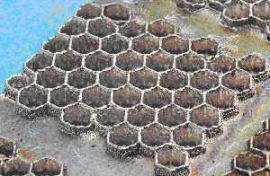 Hexagonal cell array created using Surfi-Sculpt, in Ti 6Al 4V, using a multi-stage process. Each 'cell' measuring approximately 3mm across and 3mm deep takes 0.7 seconds to create