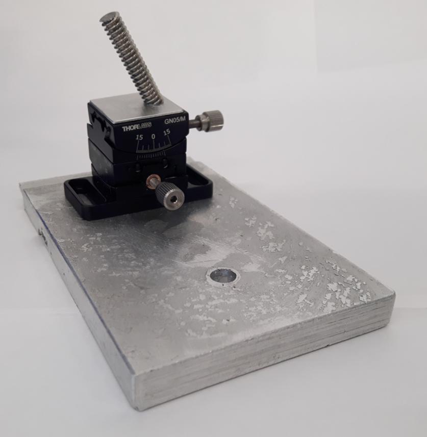 Specialised dual axis nanoindenter jig with screw.